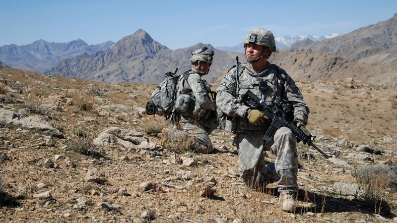 090308-A-6797M-435 U.S. Army Staff Sgt. Salvador Lopez (right) and Spc. Ashley Shaw, both assigned to 1st Battalion, 4th Infantry Regiment, U.S. Army Europe, take a knee while descending a mountain ridge near Forward Operation Base Lane in Zabul province, Afghanistan, on March 8, 2009. DoD photo by Staff Sgt. Adam Mancini, U.S. Army. (Released)