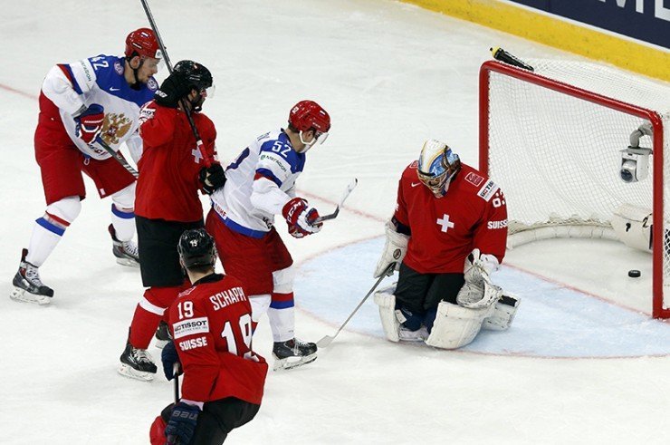 Switzerland's goalkeeper Genoni concedes a goal to Russia's Anton Belov (unseen) during the second period of their men's ice hockey World Championship Group B game at Minsk Arena in Minsk